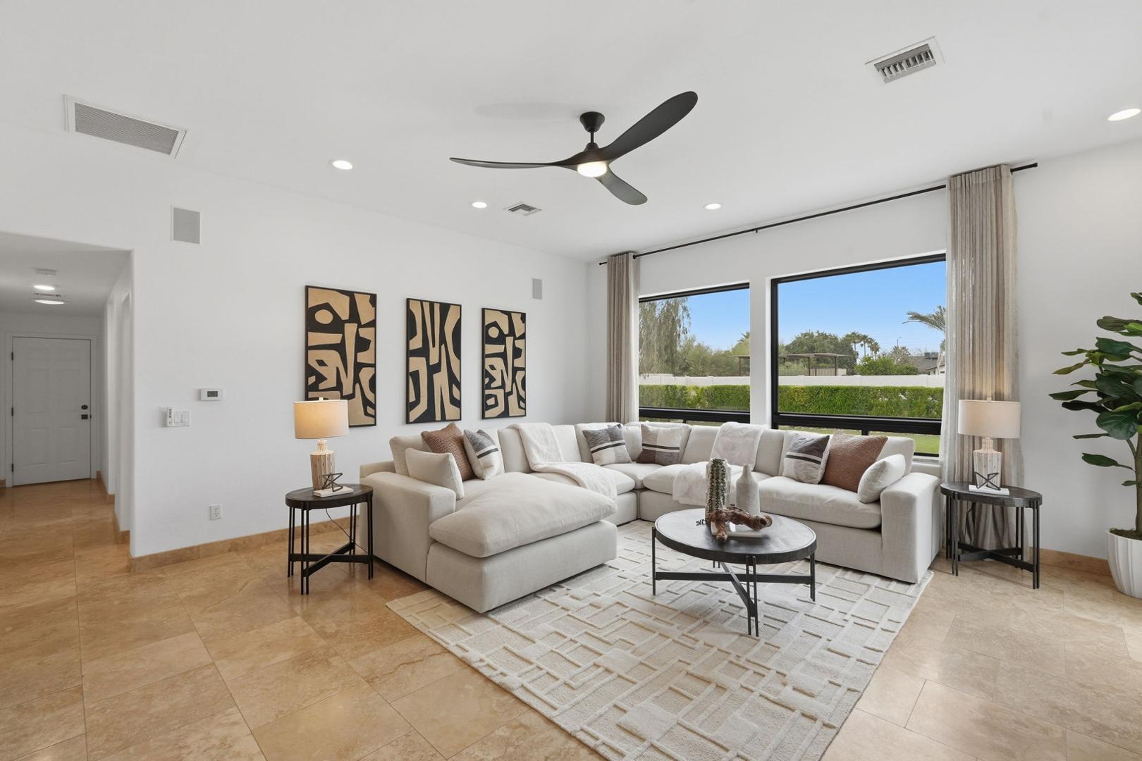 6302 East Cochise Road Paradise Valley, AZ 85253 - Photo 7 of 58 a living room with furniture and a large window