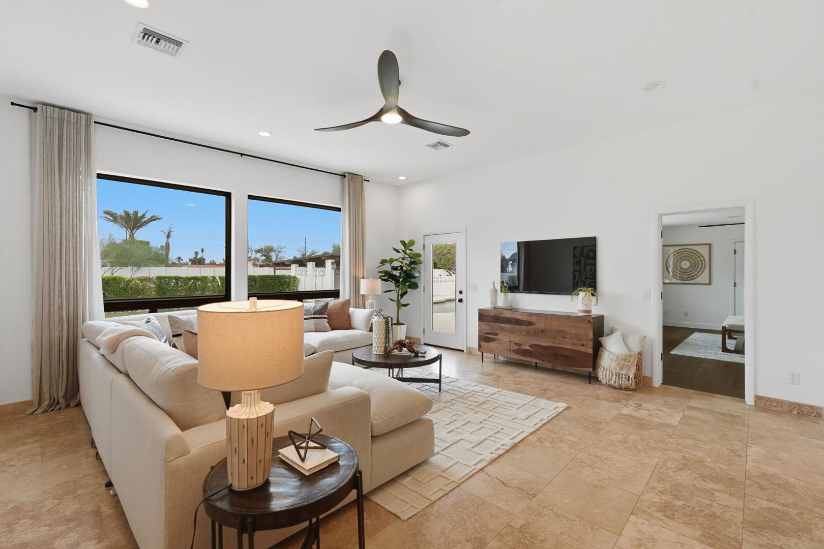 6302 East Cochise Road Paradise Valley, AZ 85253 - Photo 8 of 58 a living room with furniture and a large window