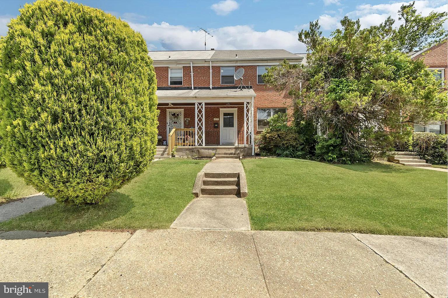 1804 Winford Road Baltimore, MD 21239 - Photo 2 of 17 Charming brick home with lush greenery.