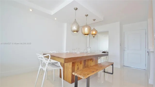 a kitchen with a table and chairs in it