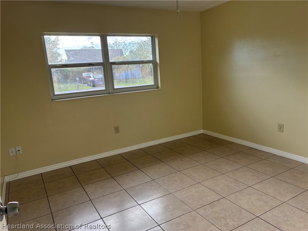 1525 Lagrange Avenue Sebring, FL 33870 - Photo 10 of 16 a view of a room that has a window in it