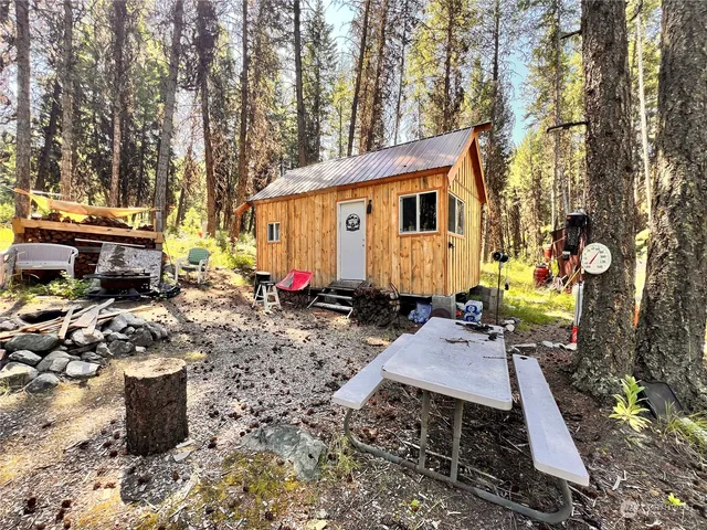 a view of a chairs and tables in the backyard