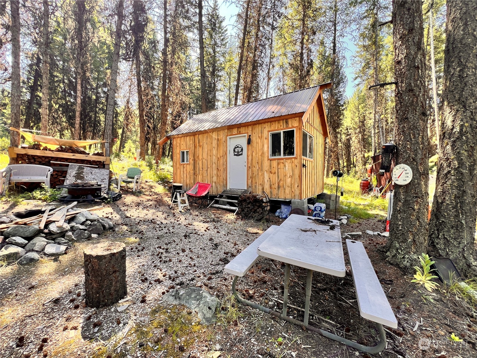 40 Excelsior Way Curlew, WA 99118 - Photo 11 of 20 a view of a chairs and tables in the backyard
