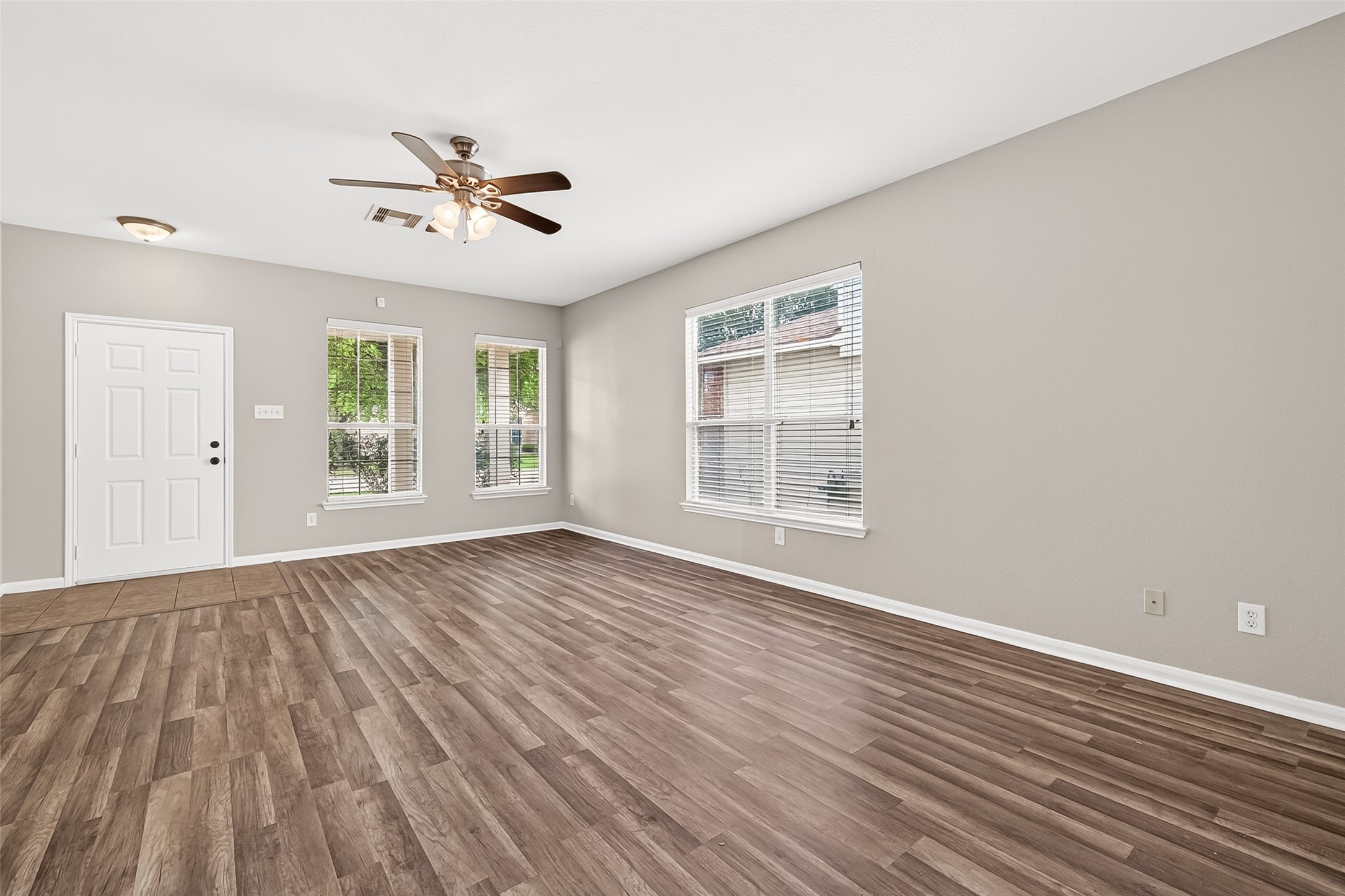 21327 Bella Flora Court Spring, TX 77379 - Photo 9 of 50 wooden floor in an empty room with a window