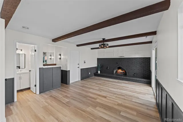 a view of a kitchen with refrigerator and cabinets