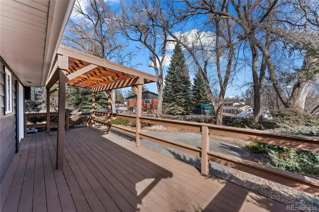 a front view of a house with a yard covered with snow in front of house