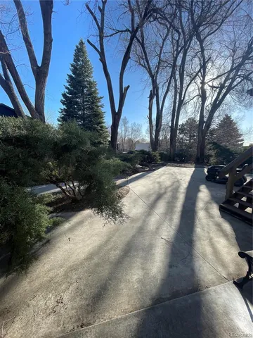 an aerial view of houses with a yard