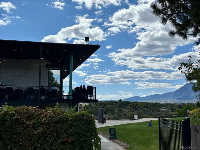 a view of a dining room with furniture a chandelier and pool table