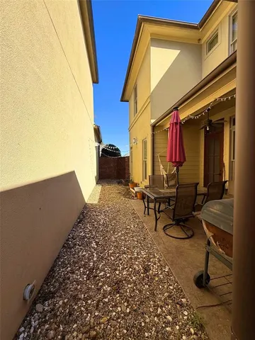 a view of a backyard with sitting area