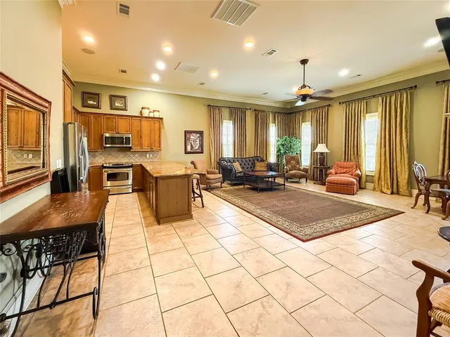 a living room with lots of furniture and a flat screen tv