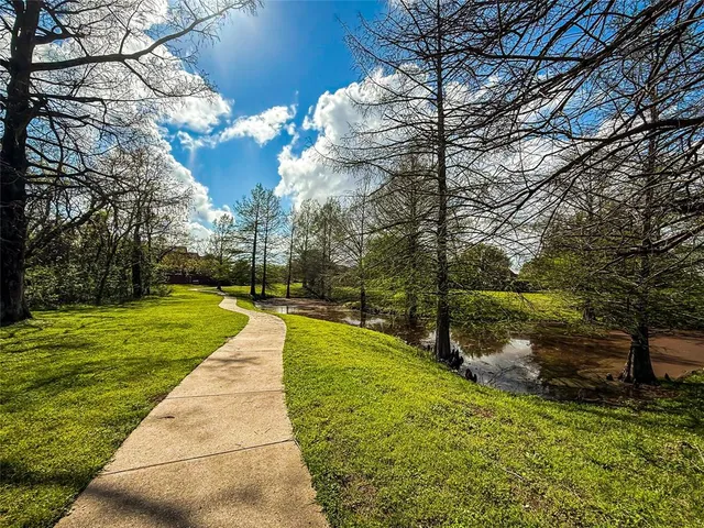 a view of a lake with houses in the back