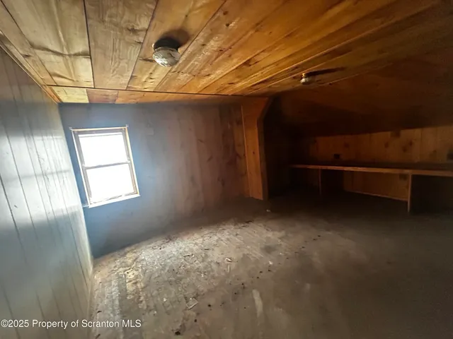 a bathroom with a tub sink and vanity