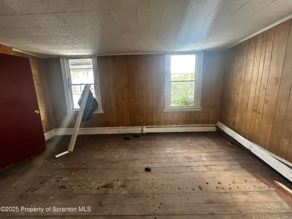 an empty room with windows