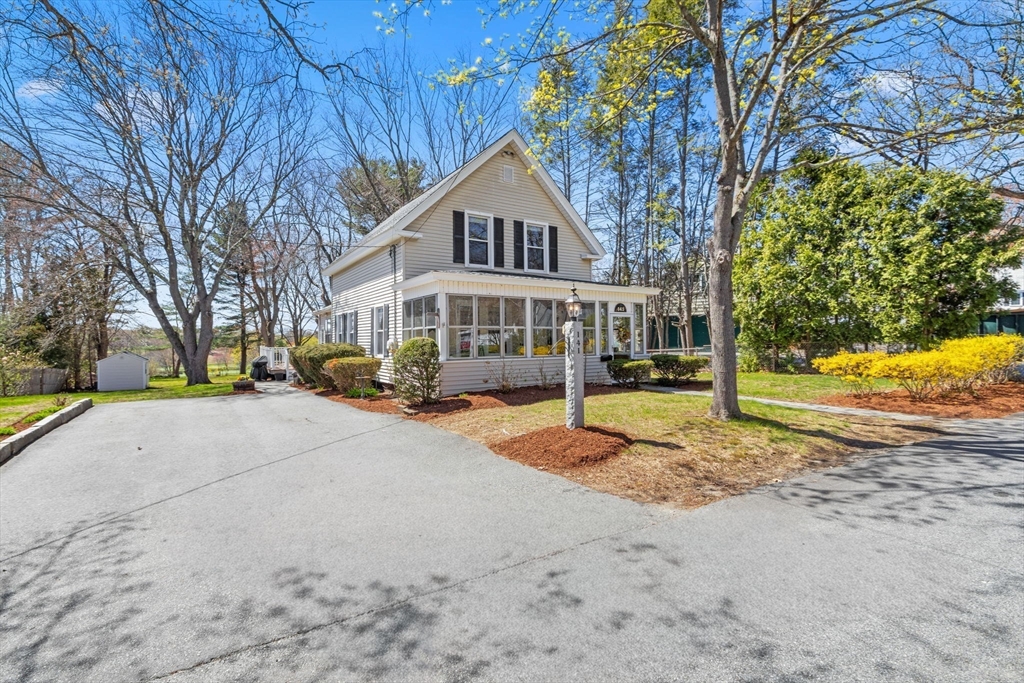 141 Westview Road Lowell, MA 01851 - Photo 1 of 39 a house with trees in the background