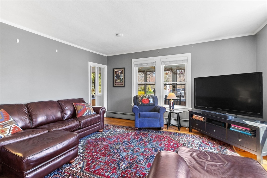 141 Westview Road Lowell, MA 01851 - Photo 11 of 39 a living room with furniture and a flat screen tv
