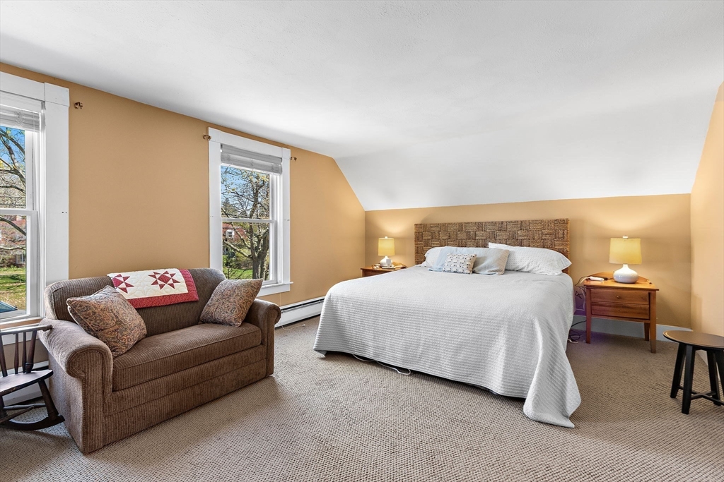 141 Westview Road Lowell, MA 01851 - Photo 13 of 39 a bedroom with a bed couch and a window