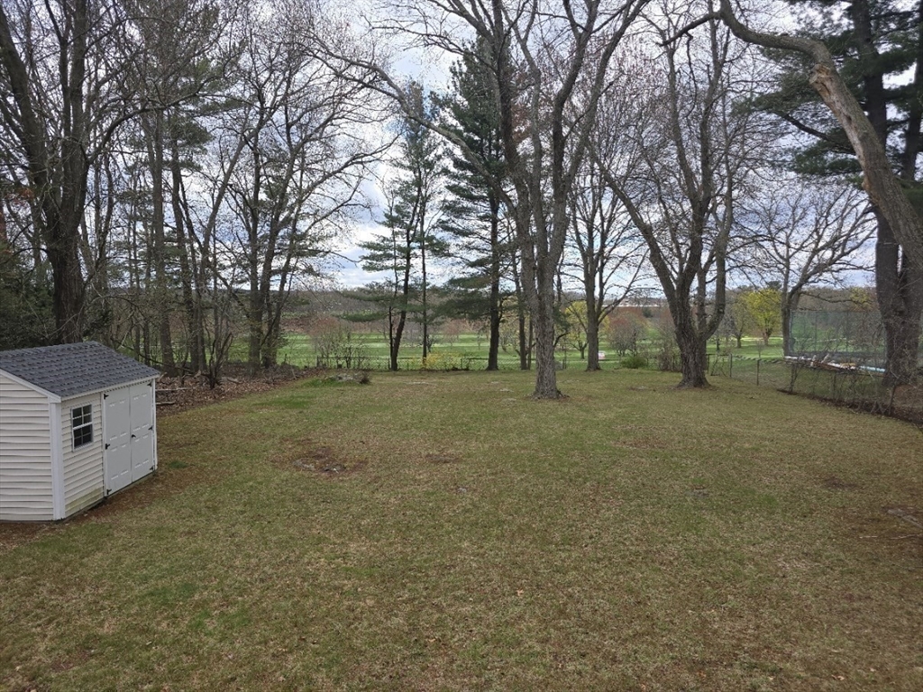 141 Westview Road Lowell, MA 01851 - Photo 20 of 39 a view of outdoor space with deck and tree