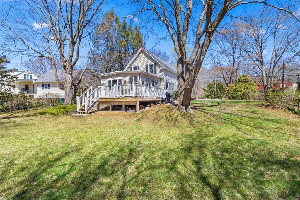 141 Westview Road Lowell, MA 01851 - Photo 26 of 39 a big house with lots of trees and plants