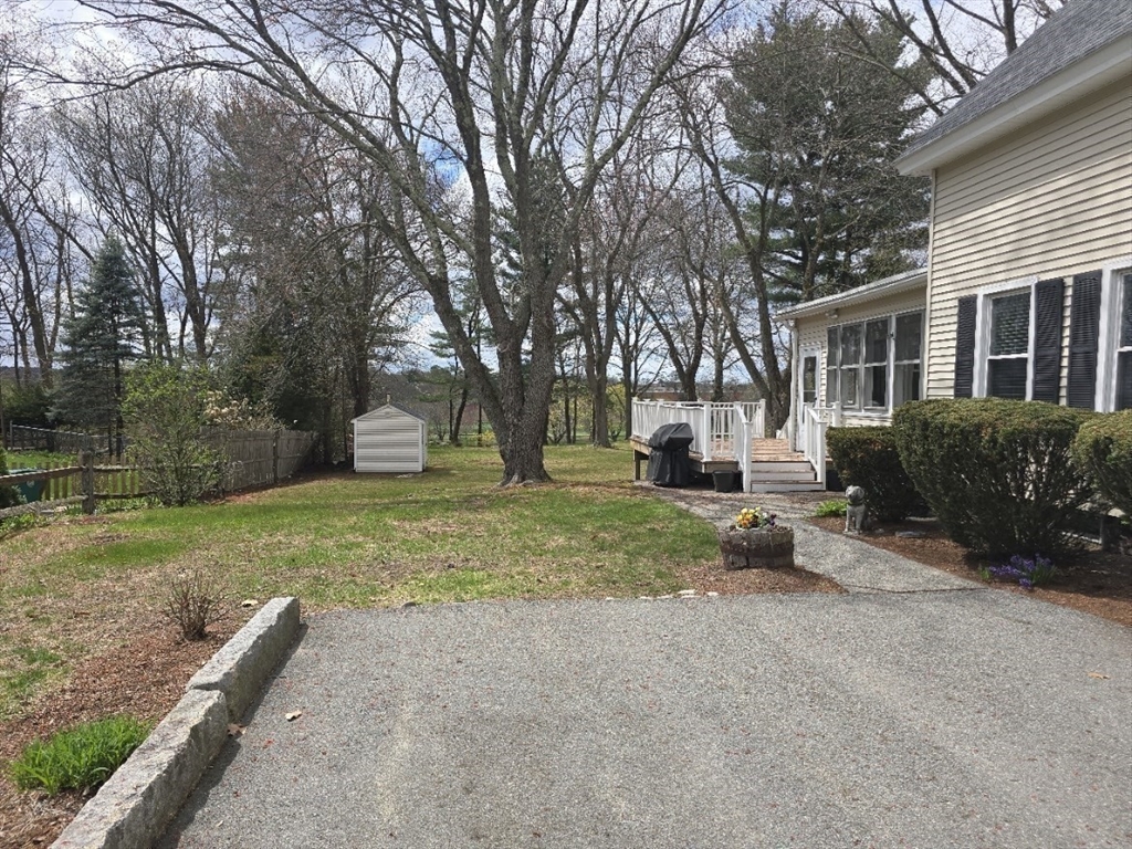 141 Westview Road Lowell, MA 01851 - Photo 30 of 39 a view of a house with backyard and a tree
