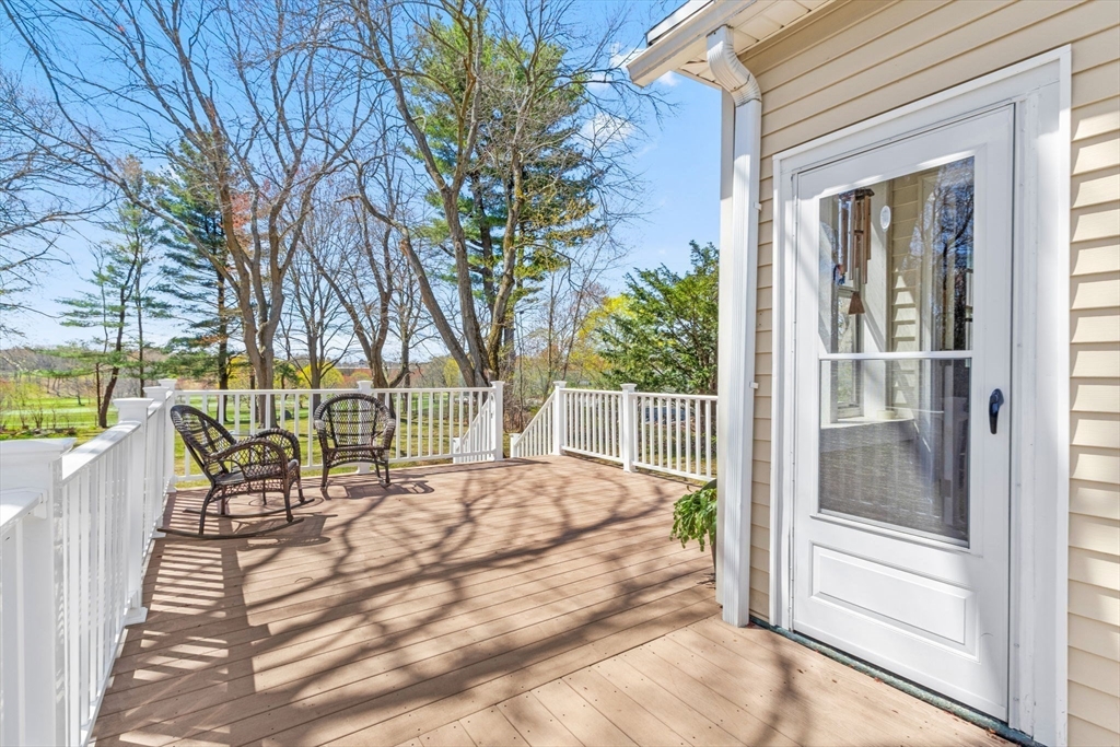 141 Westview Road Lowell, MA 01851 - Photo 3 of 39 a balcony with a table and chairs