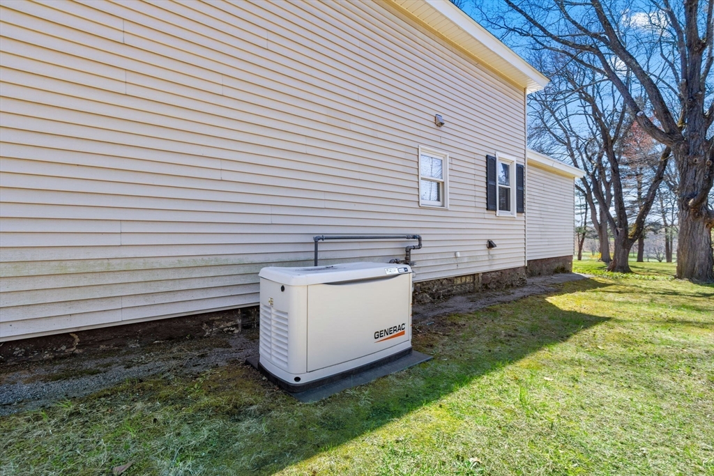 141 Westview Road Lowell, MA 01851 - Photo 32 of 39 a view of a small yard and a large tree