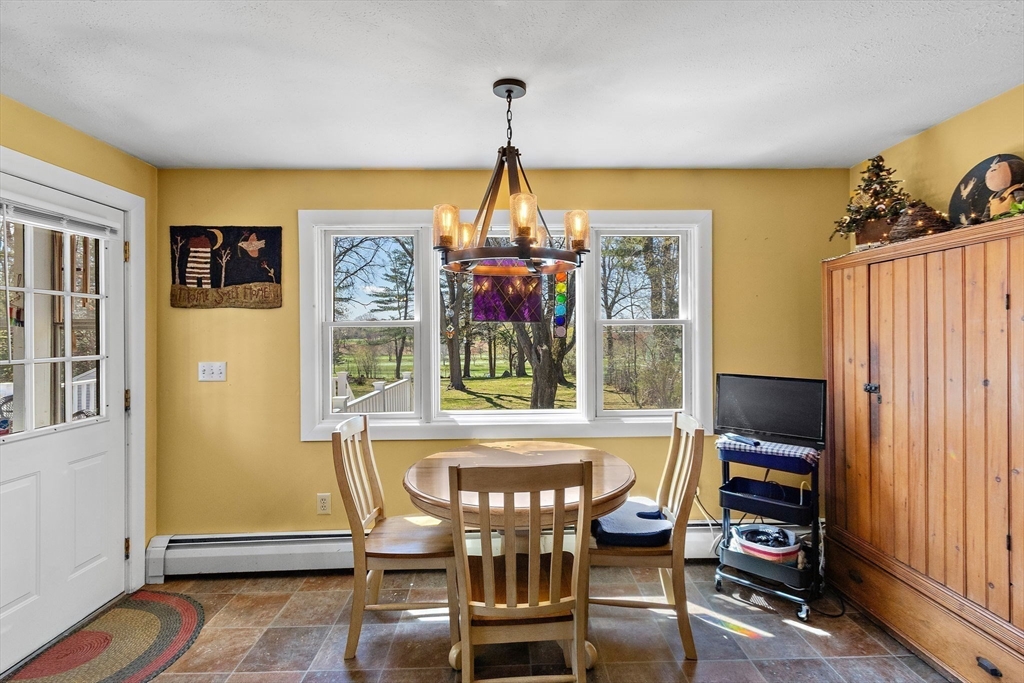 141 Westview Road Lowell, MA 01851 - Photo 7 of 39 a view of a dining room with furniture window and outside view