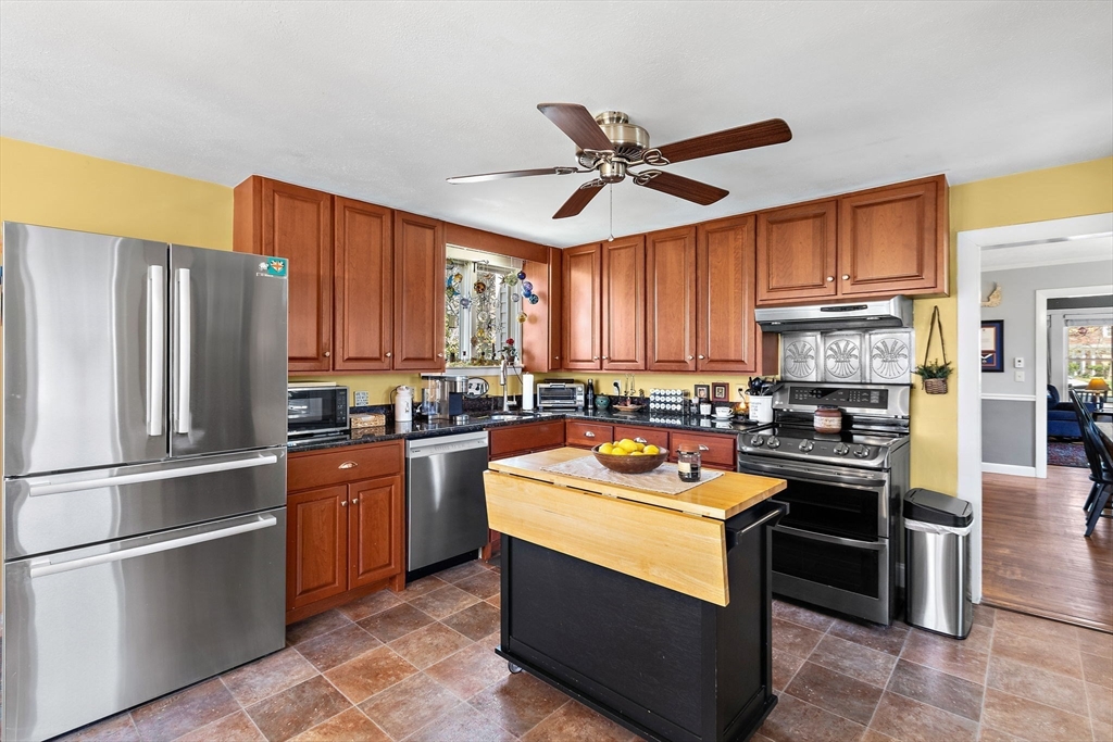 141 Westview Road Lowell, MA 01851 - Photo 8 of 39 a kitchen with stainless steel appliances granite countertop a stove refrigerator sink and dishwasher