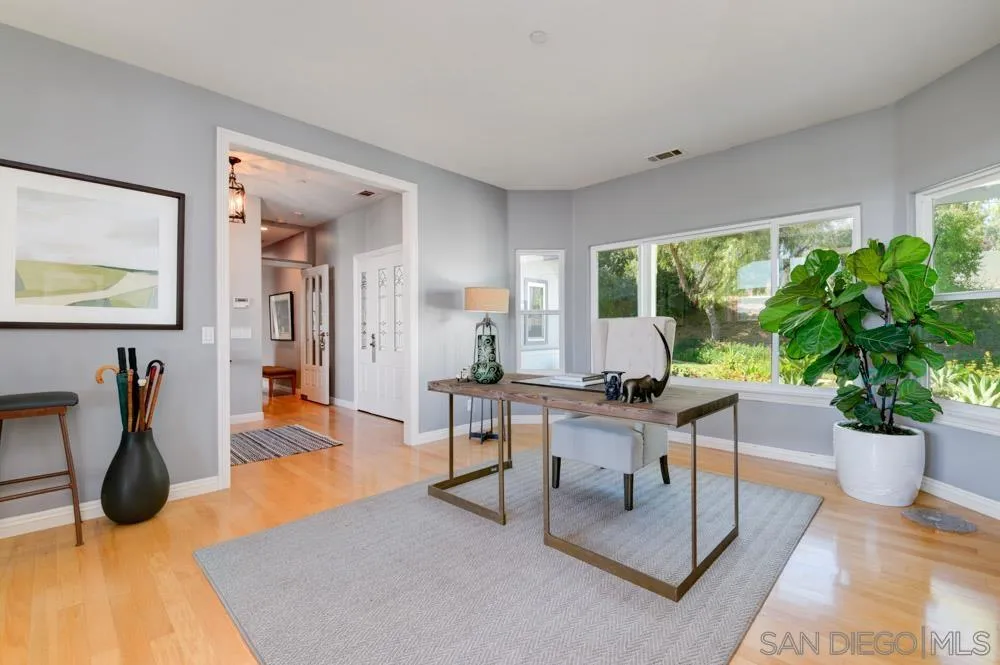 1834 Winterwarm Drive Fallbrook, CA 92028 - Photo 15 of 49 a living room with furniture potted plant and a large window