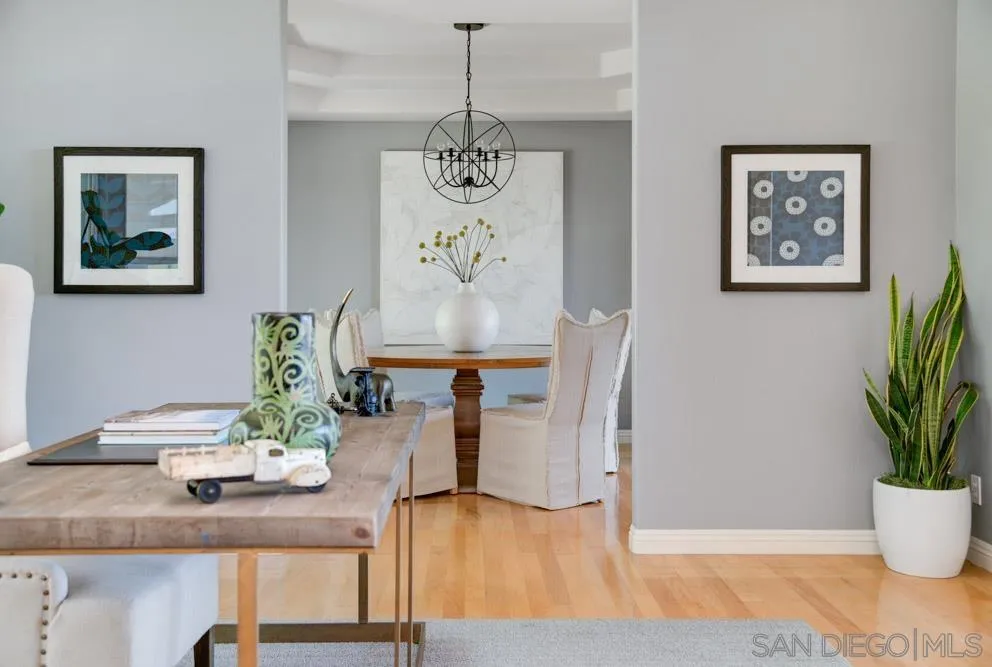 1834 Winterwarm Drive Fallbrook, CA 92028 - Photo 16 of 49 a view of a dining room with furniture and wooden floor