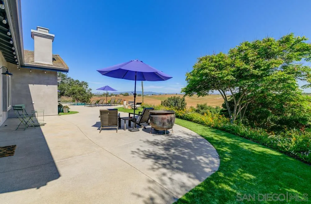 1834 Winterwarm Drive Fallbrook, CA 92028 - Photo 25 of 49 a view of a patio with chairs and potted plants