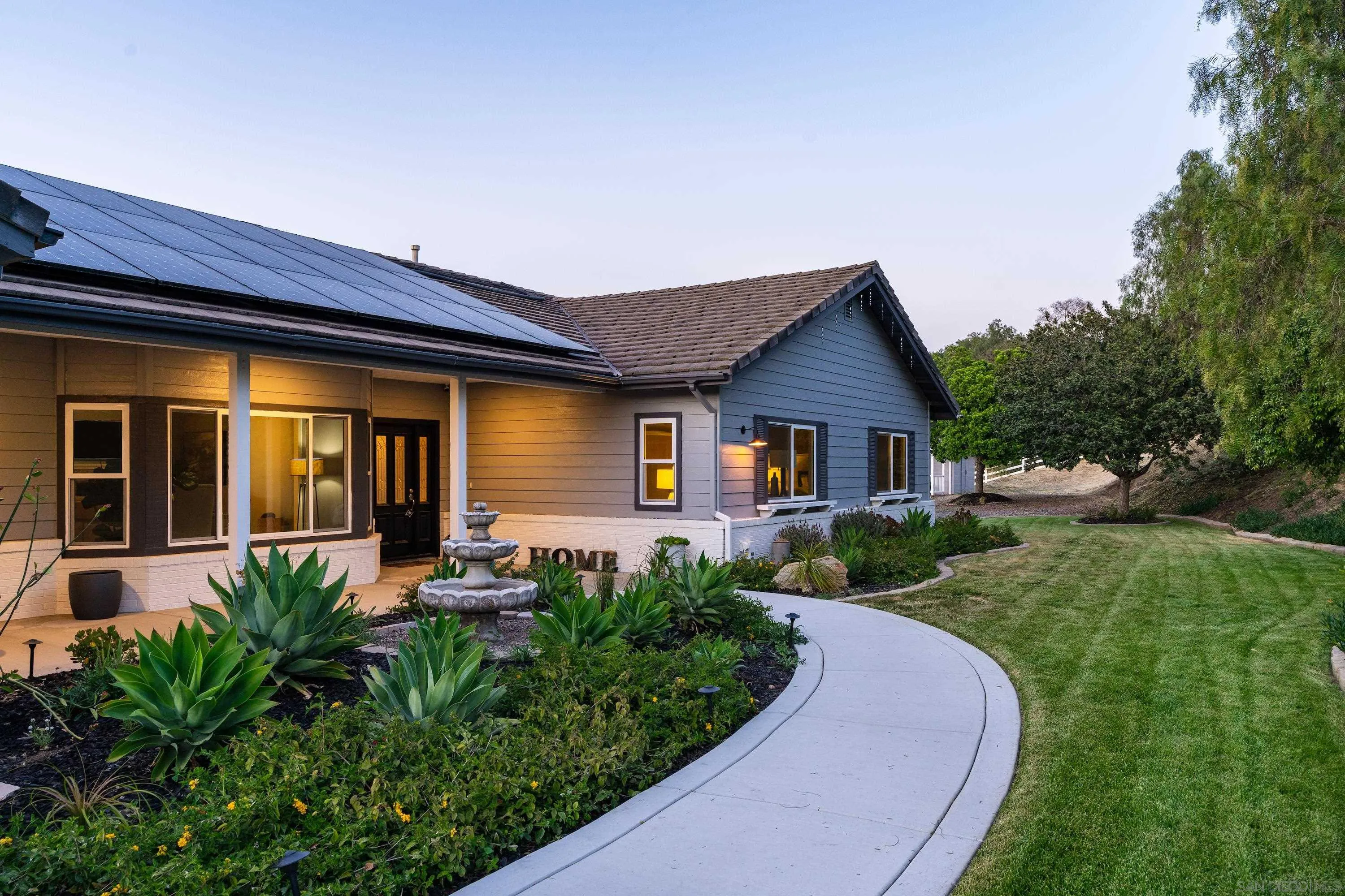 1834 Winterwarm Drive Fallbrook, CA 92028 - Photo 3 of 49 a front view of a house with garden