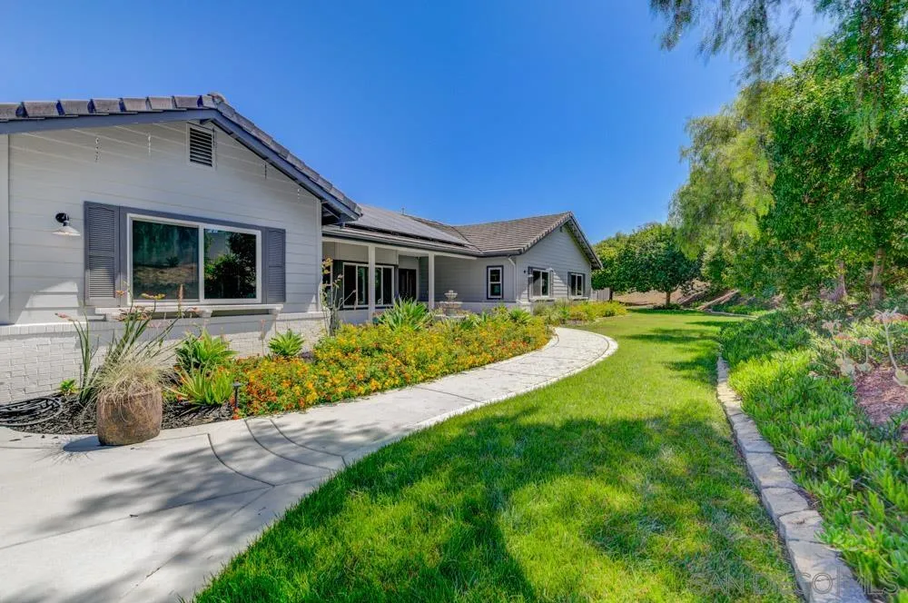 1834 Winterwarm Drive Fallbrook, CA 92028 - Photo 32 of 49 a view of house with a yard