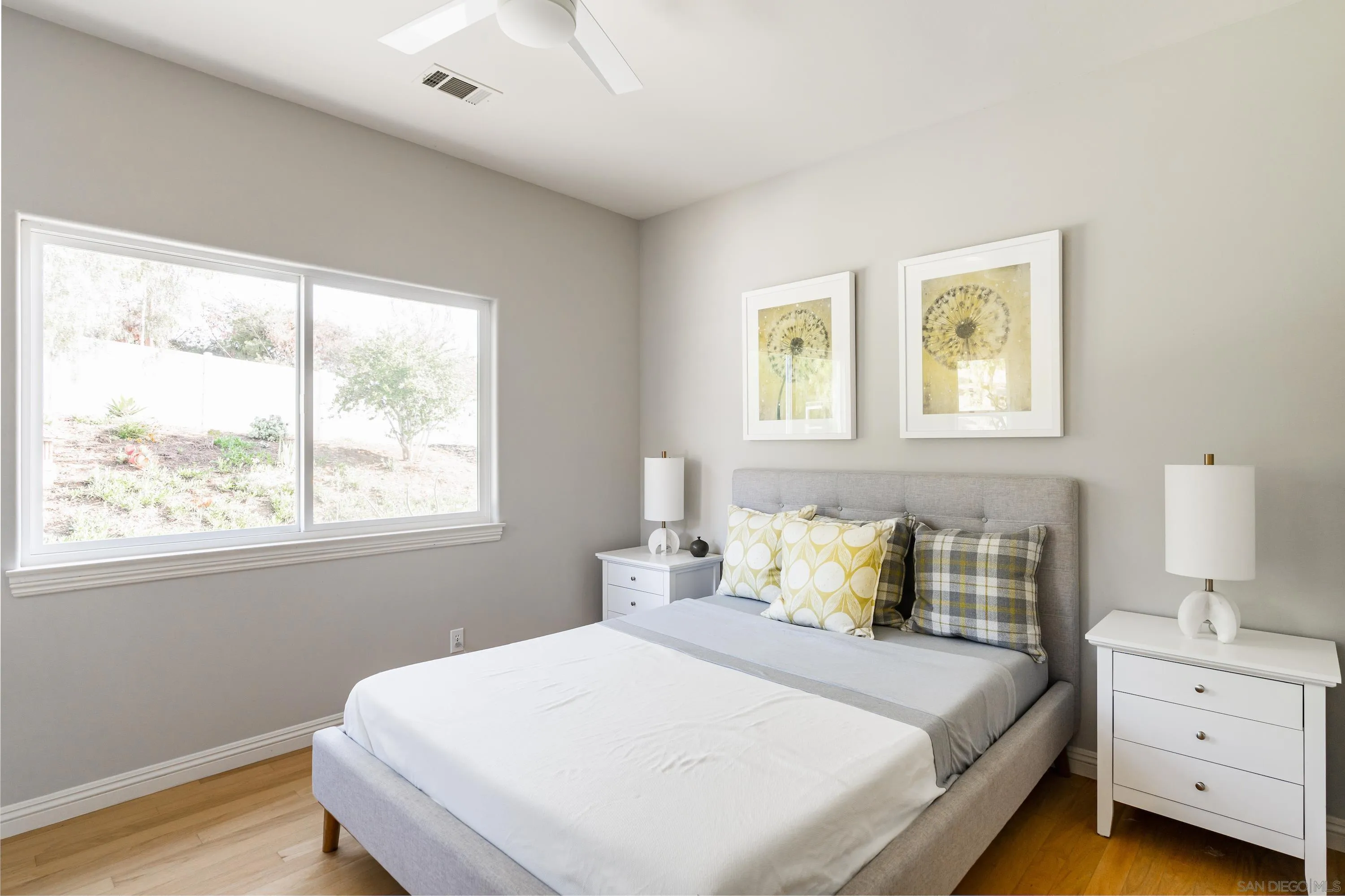 1834 Winterwarm Drive Fallbrook, CA 92028 - Photo 37 of 49 a bedroom with a bed and a window