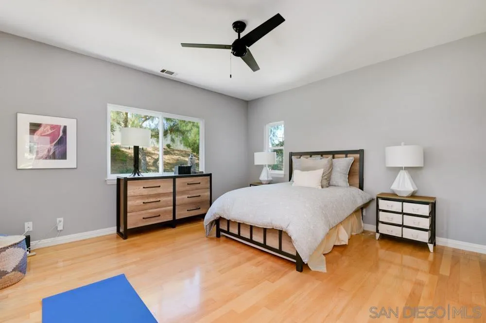 1834 Winterwarm Drive Fallbrook, CA 92028 - Photo 39 of 49 a bedroom with a bed and a night stand