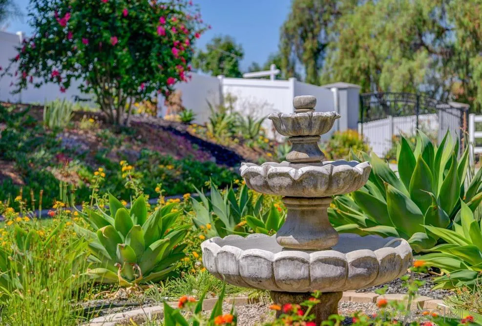 1834 Winterwarm Drive Fallbrook, CA 92028 - Photo 49 of 49 a kitchen with a fountain and flowers