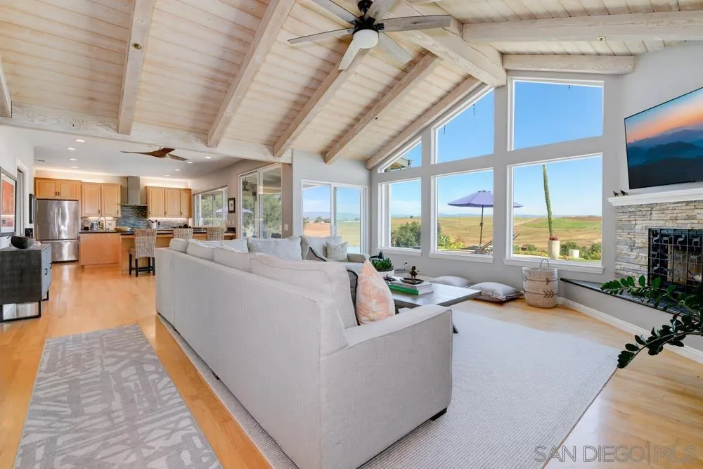 1834 Winterwarm Drive Fallbrook, CA 92028 - Photo 5 of 49 a living room with furniture kitchen view and a large window