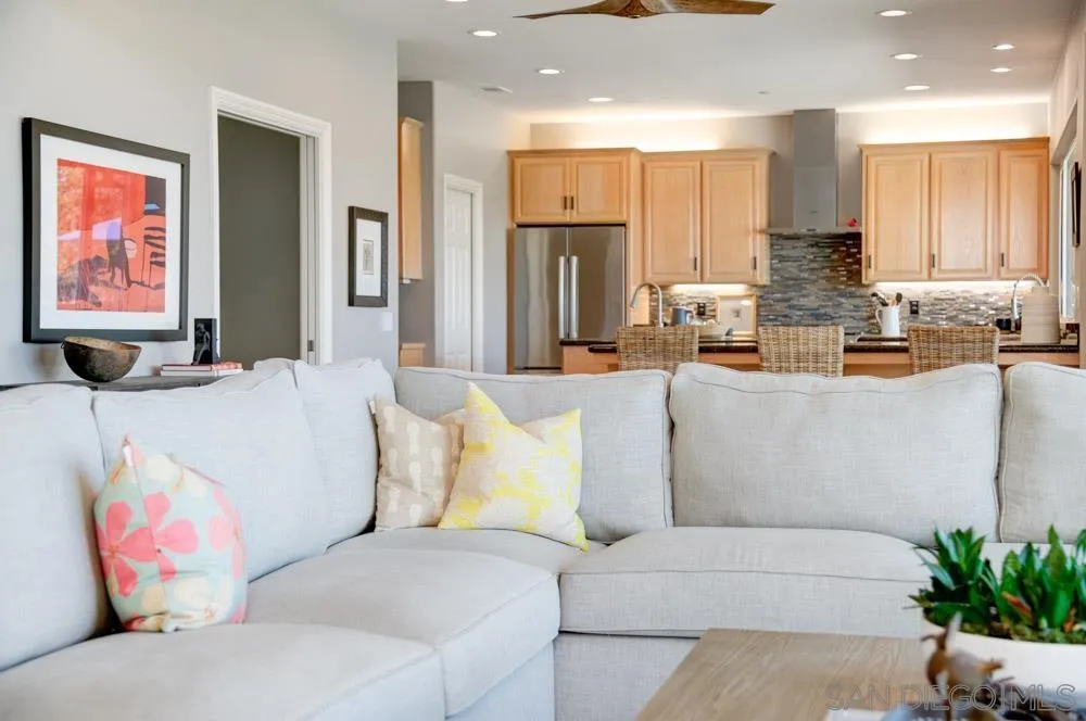 1834 Winterwarm Drive Fallbrook, CA 92028 - Photo 9 of 49 a living room with stainless steel appliances kitchen island granite countertop furniture and a couch