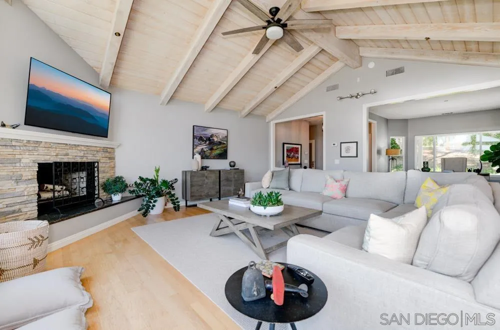 1834 Winterwarm Drive Fallbrook, CA 92028 - Photo 10 of 49 a living room with furniture and a flat screen tv
