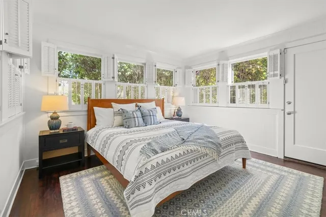 a bedroom with bed and window