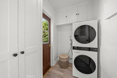 a view of a hallway with washer and dryer