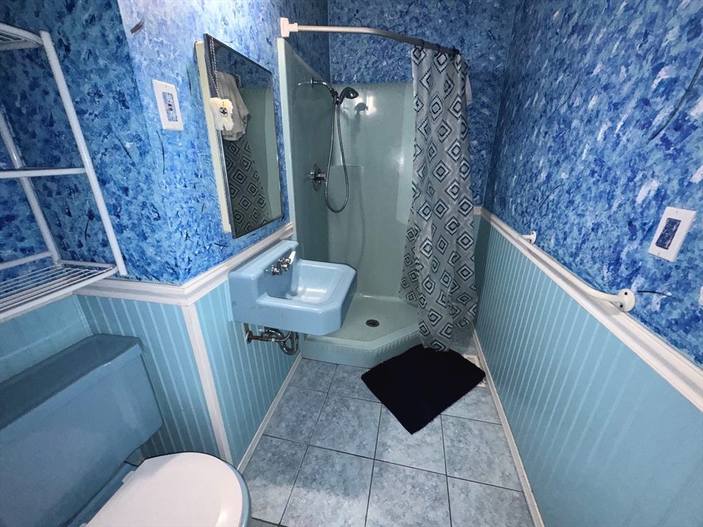 37 David Street Springfield, MA 01104 - Photo 27 of 29 a bathroom with a sink and mirror