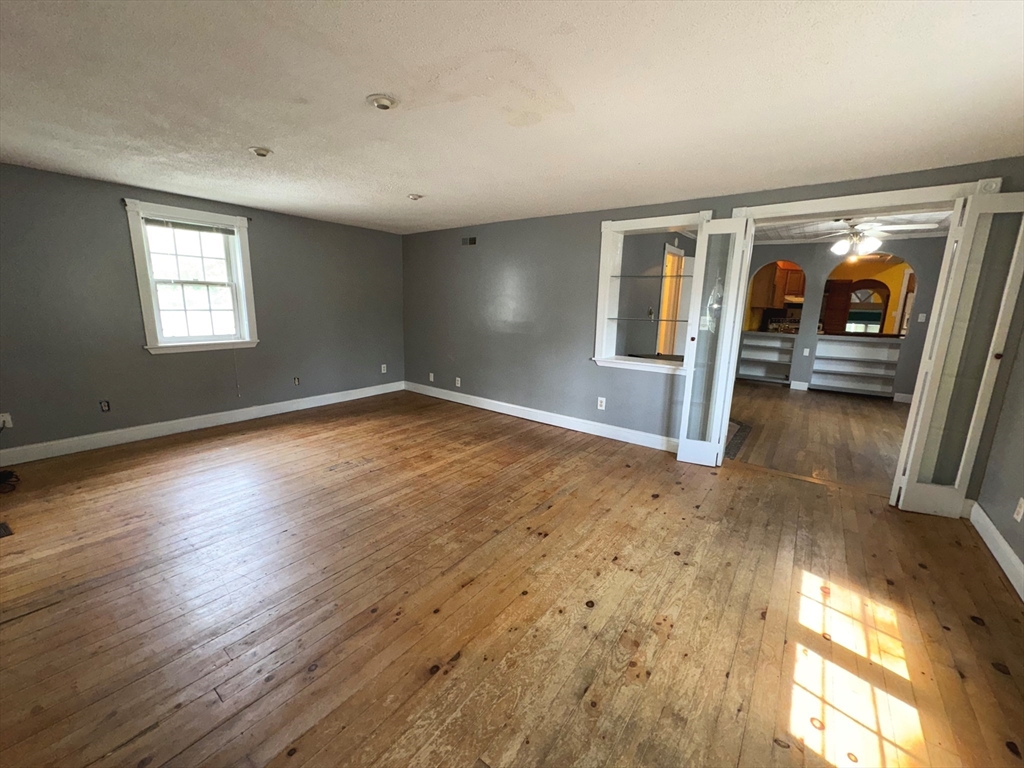 37 David Street Springfield, MA 01104 - Photo 4 of 29 wooden floor in an empty room with a window