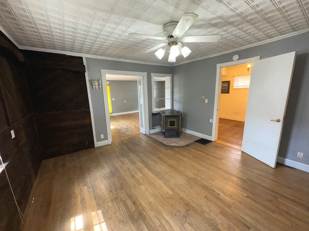 37 David Street Springfield, MA 01104 - Photo 8 of 29 an empty room with wooden floor and chandelier
