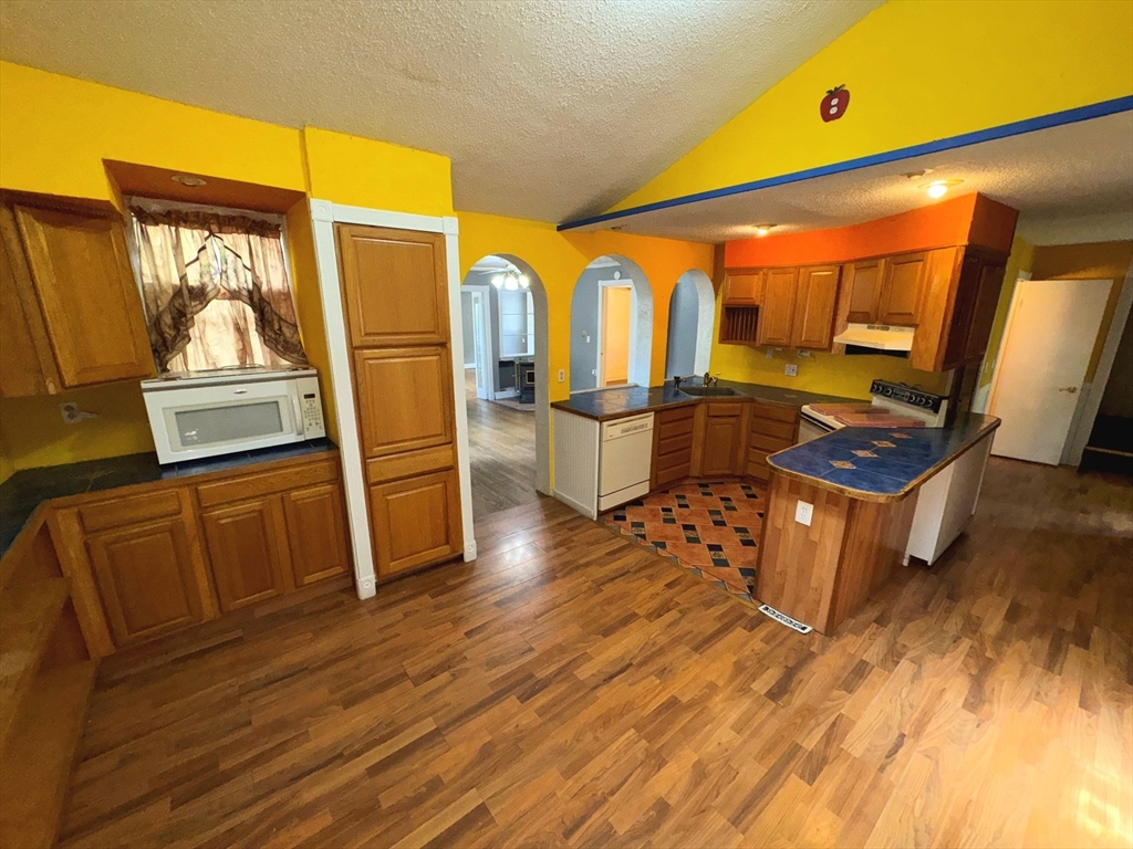 37 David Street Springfield, MA 01104 - Photo 10 of 29 a living room with wooden floor and furniture