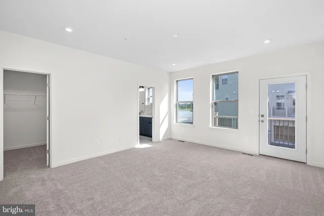 an empty room with closet area