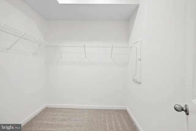 a bathroom with a sink a toilet a mirror a bathtub and shower