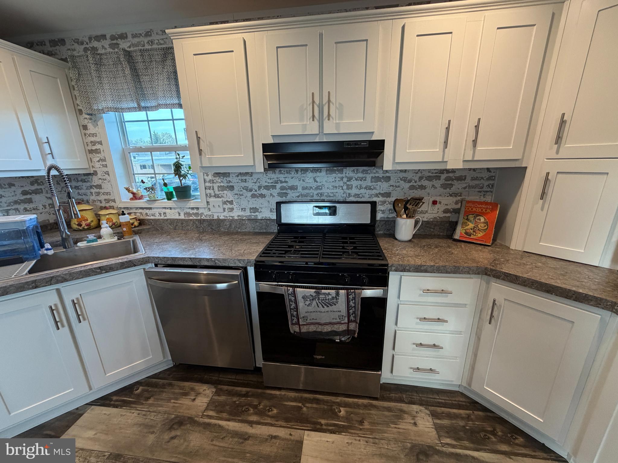 92 Ridgewood Manor Manheim, PA 17545 - Photo 11 of 22 a kitchen with stainless steel appliances granite countertop a stove a sink and a microwave