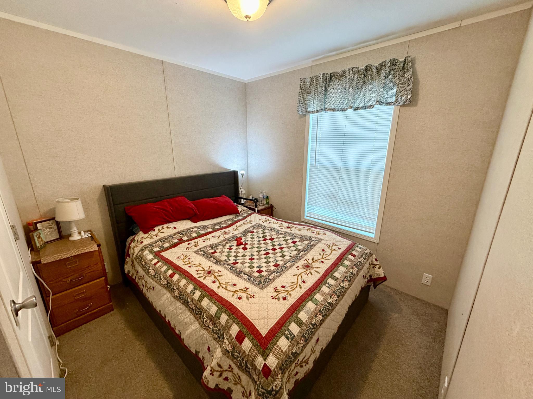 92 Ridgewood Manor Manheim, PA 17545 - Photo 18 of 22 a bed sitting in a bedroom next to a window