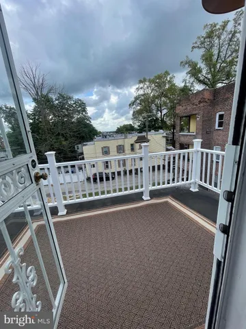 a view of balcony with furniture