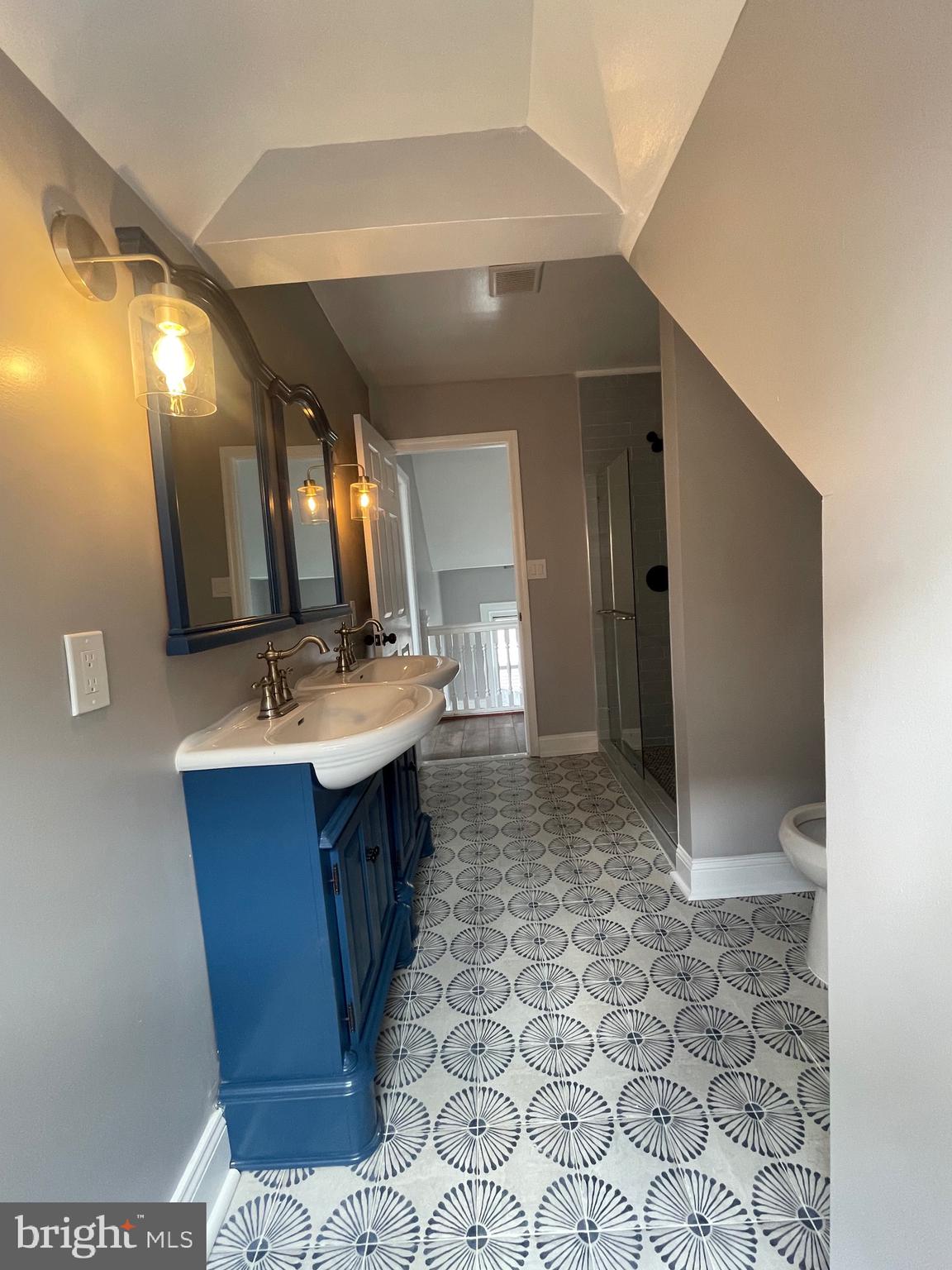 2403 Garrison Boulevard Baltimore, MD 21216 - Photo 28 of 34 a bathroom with a sink and a mirror